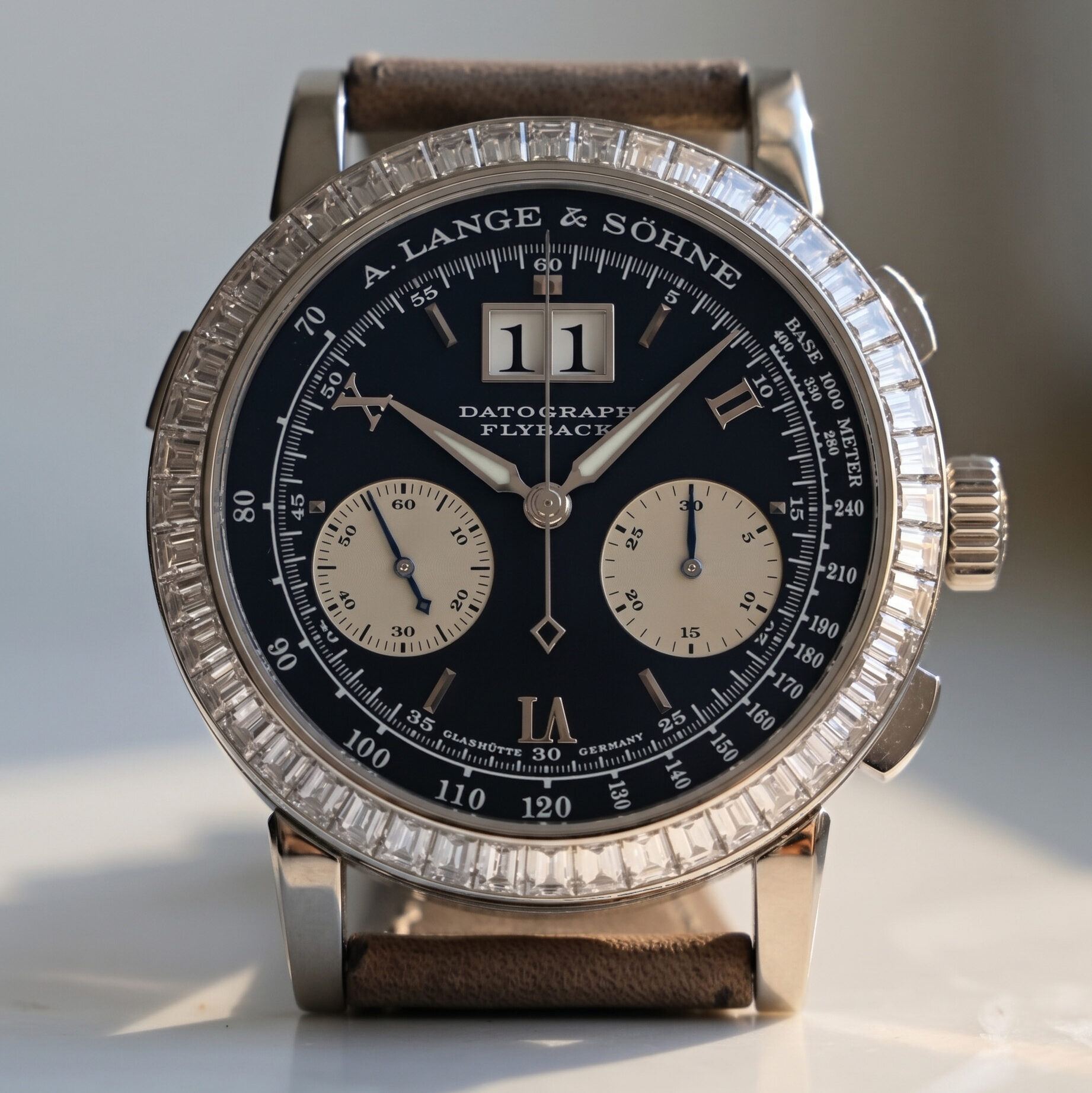A Lange Söhne Datograph with baguette diamond bezel from the dial side reference 815.036